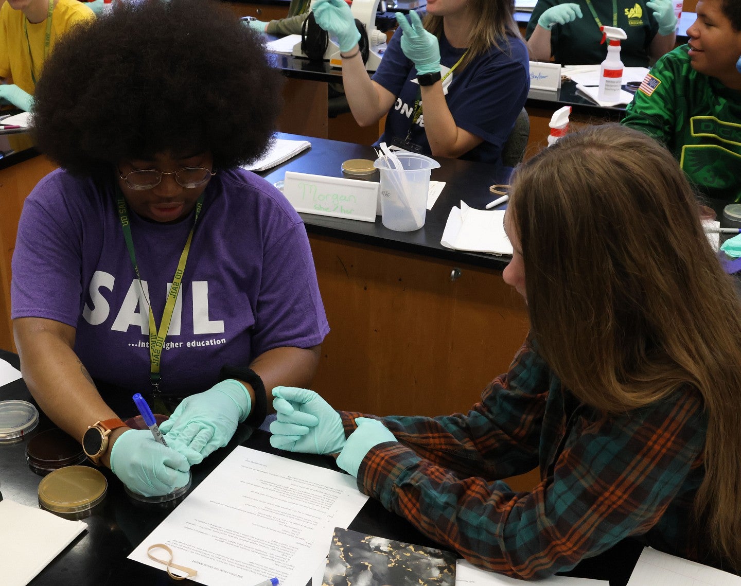 two SAIL students do science task