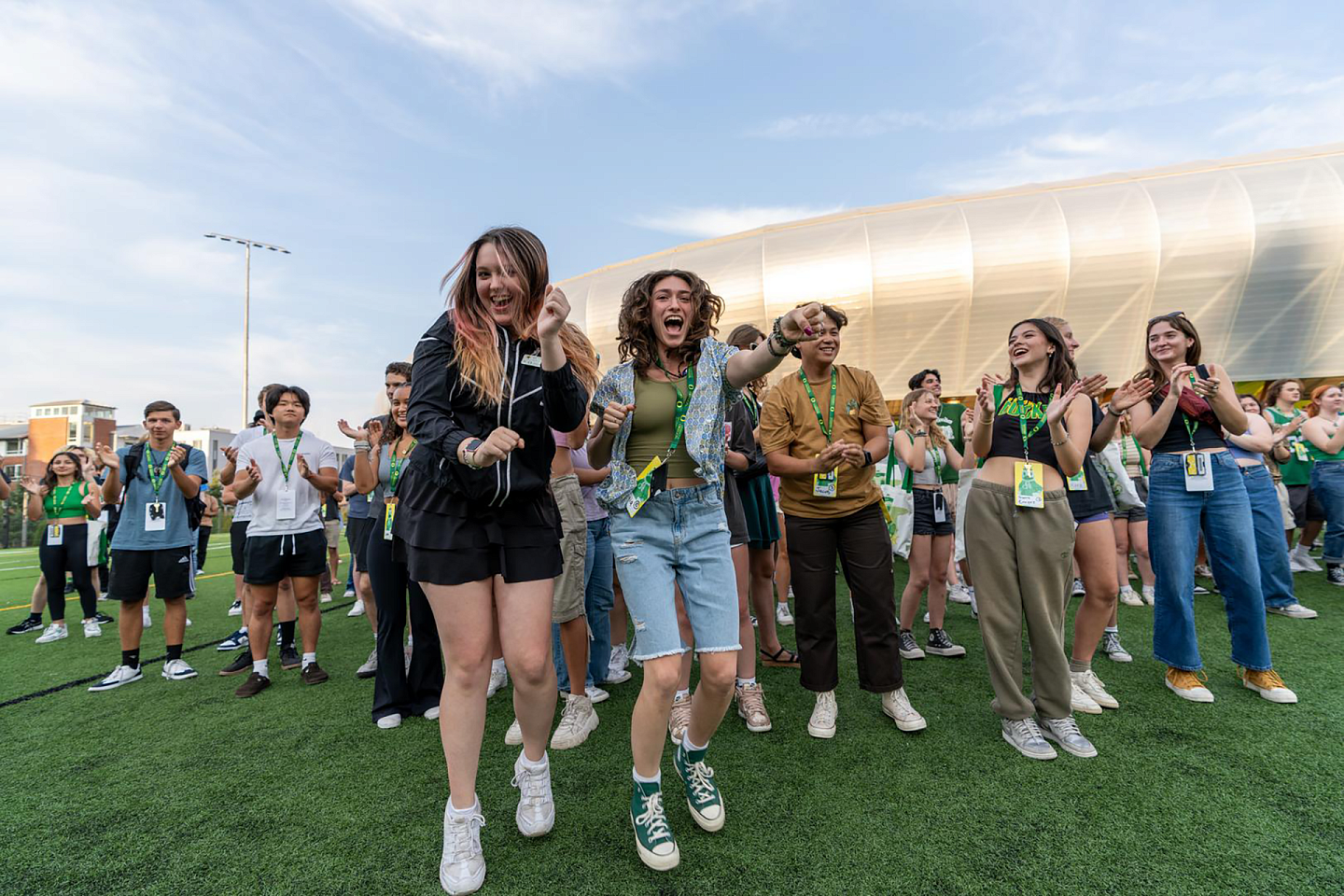 an excited group of students outside